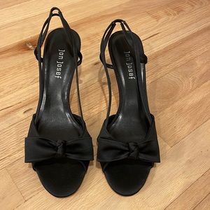 Black sling back heels with bow detail